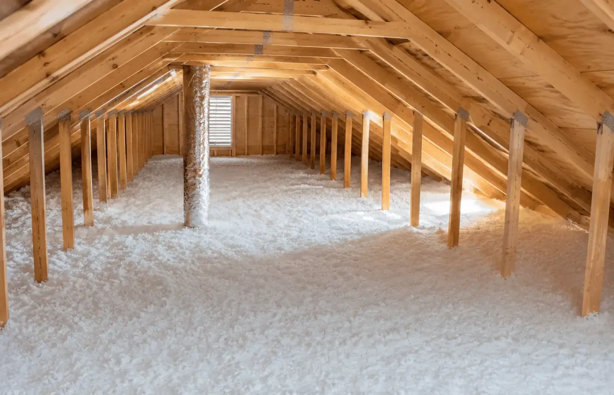 Crew safely removing old contaminated attic insulation