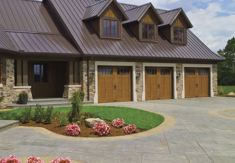 Three-car garage with Clopay garage doors